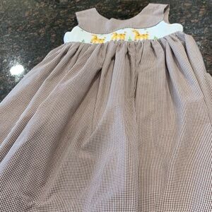 Adorable Brown and White gingham smocked dress. Excellent condition, size 4.
